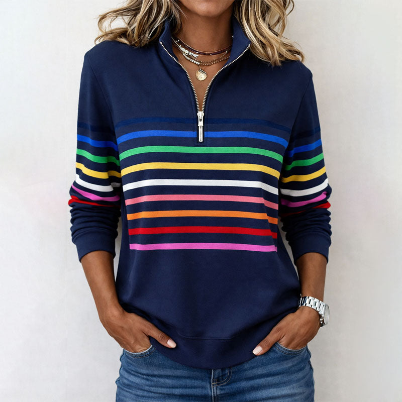 Colorful striped half-zip sweatshirt by Lumina Wear featuring vibrant patterns and a comfortable fit.