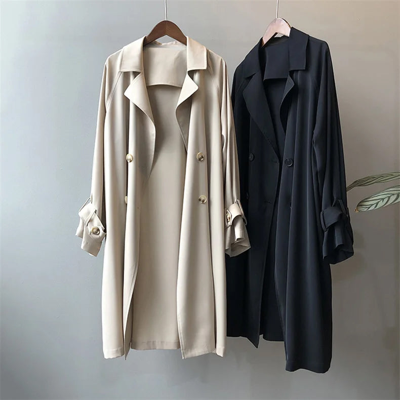 Elegant black women's trench coat with classic closure from Lumina Wear, featuring a tailored fit and stylish design.