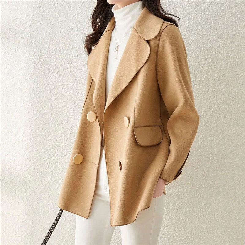 Elegant black wool coat with structured lapels from Lumina Wear, featuring a tailored fit and classic design.