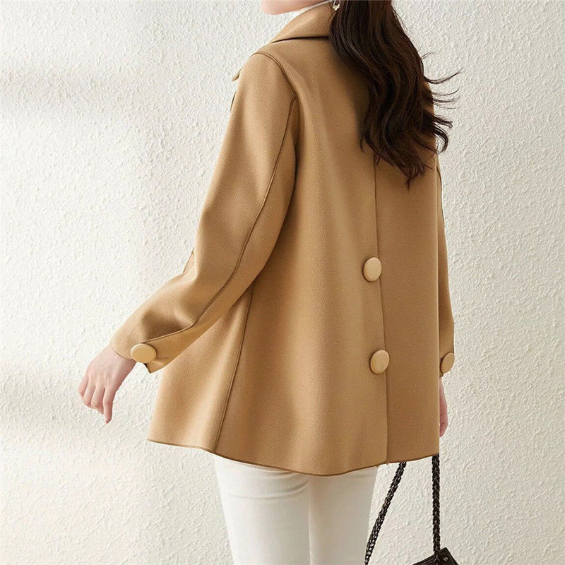 Elegant double-breasted wool coat with structured lapels from Lumina Wear's Valentina collection, shown in a stylish, tailored fit.