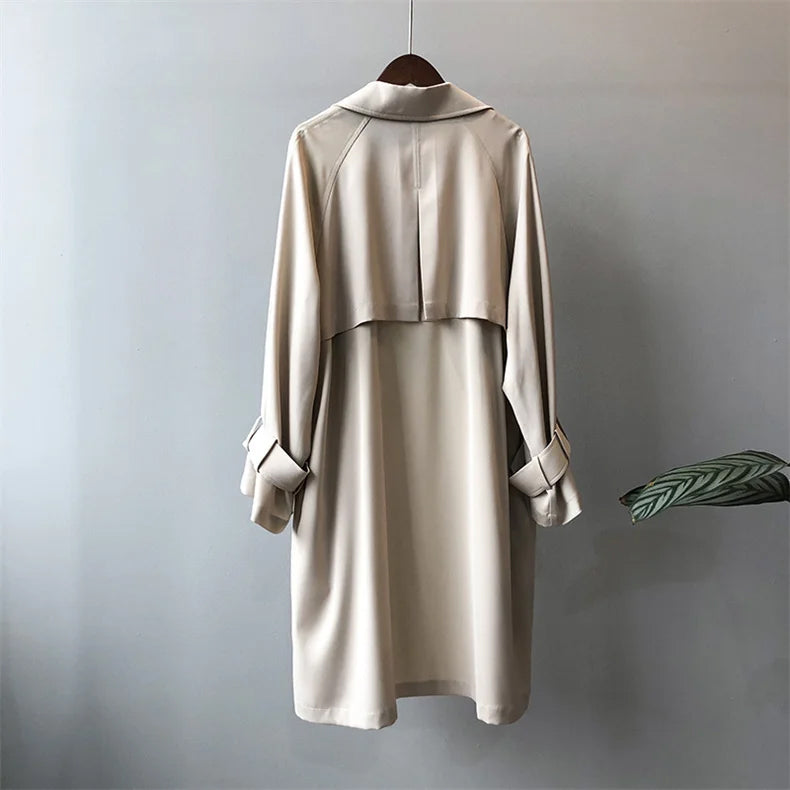 Elegant lightweight black trench coat with silky drape from Lumina Wear, designed for women's coats and jackets.