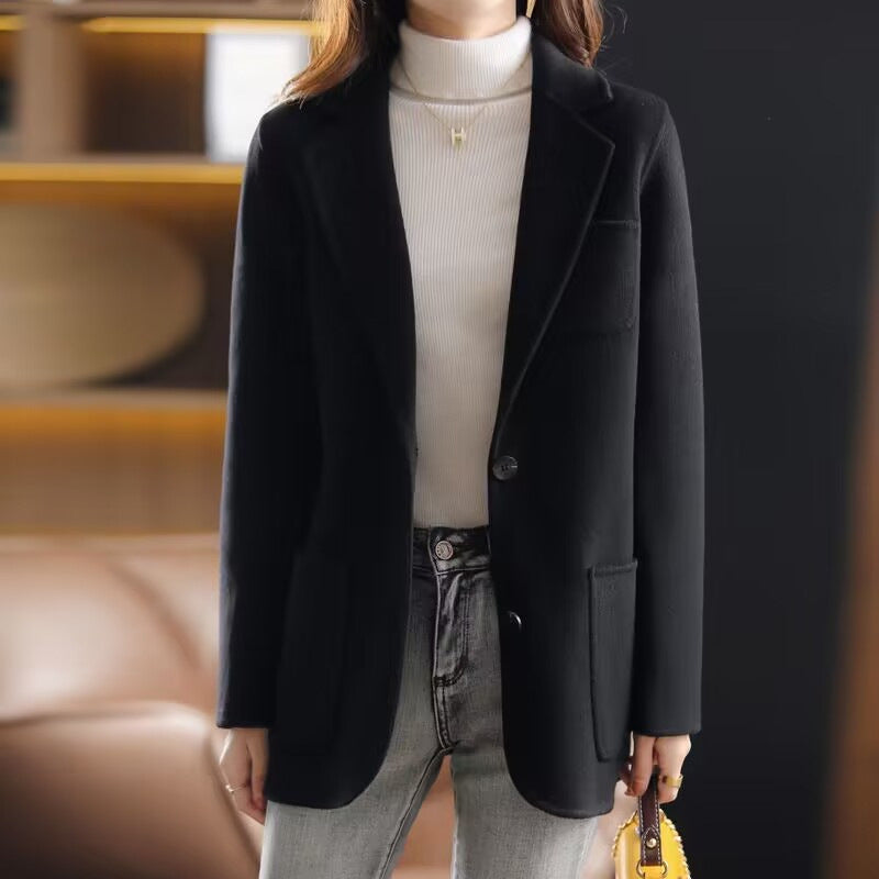 Valentina Lumina Wear elegant relaxed fit wool coat with lapel collar, shown in a stylish beige color on a model.