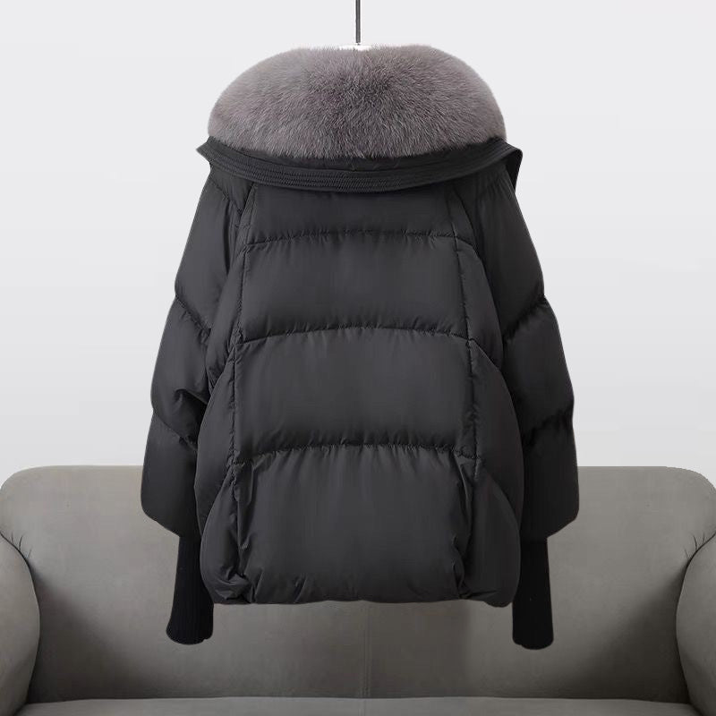Extended-length black puffer jacket with fur collar by Lumina Wear, featuring a cozy, stylish winter puffer coat for women.