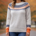 Multicolor Nordic-inspired knit sweater with bold pattern from Lumina Wear, featuring intricate design and cozy fabric.