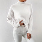 Lumina Wear Valentina relaxed mock neck knit sweater with ribbed cuffs in soft, cozy fabric, shown on a model.