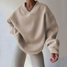 Light pink Valentina oversized sweater with V-neckline from Lumina Wear, relaxed fit, perfect for casual and cozy style.
