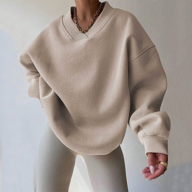 Light pink Valentina oversized sweater with V-neckline from Lumina Wear, relaxed fit, perfect for casual and cozy style.