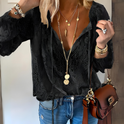 Lumina Wear Victoria bohemian V-neck blouse with decorative detailing, featuring flowing fabric and intricate design elements.