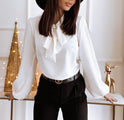 Lumina Wear Victoria blouse with bow tie neckline and puffed sleeves, stylish and elegant women's blouse on a model.
