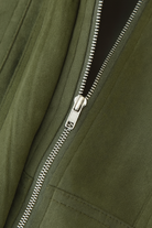 Green Lumina Wear Victoria bomber jacket with elegant design and timeless style, shown on a model.