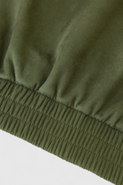 Elegant green bomber jacket from Lumina Wear, featuring a stylish fit and timeless design perfect for casual or chic outfits.
