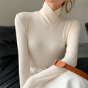 Lumina Wear Victoria elegant mock neck top with streamlined fit, displayed on a mannequin, showcasing stylish casual fashion.