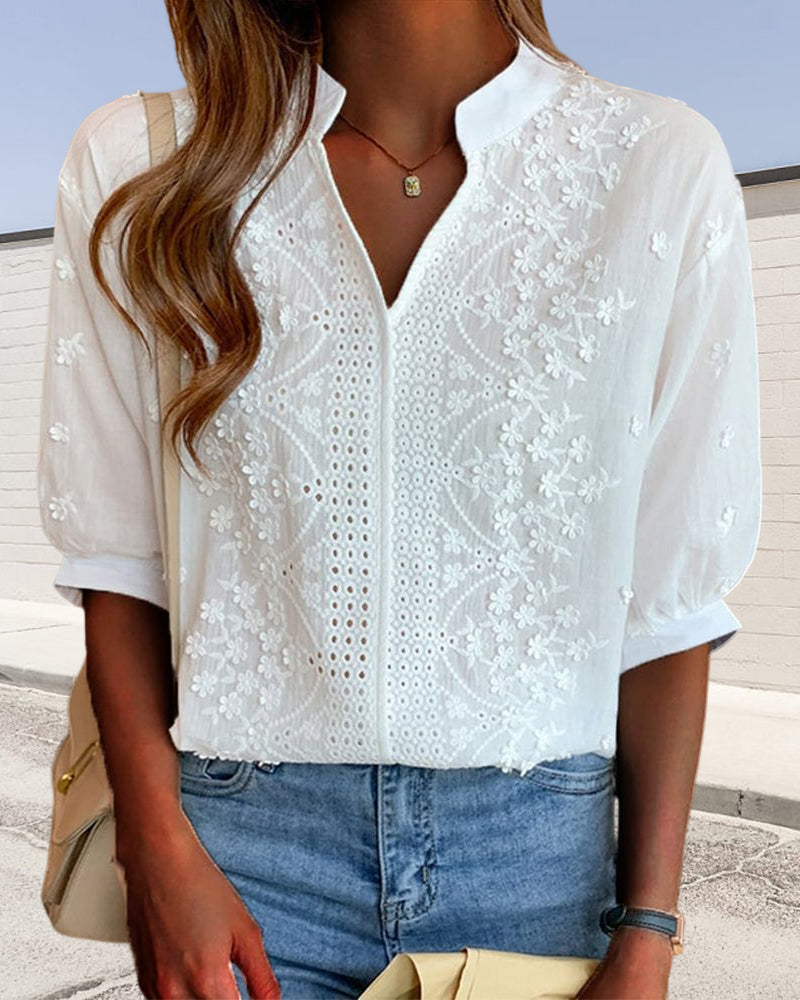 Victoria Lumina puff sleeve blouse with V-neck design, featuring elegant fabric and stylish detailing.