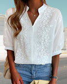 Light pink Victoria Lumina Wear puff sleeve blouse with V-neck, showcasing elegant design and soft fabric details.