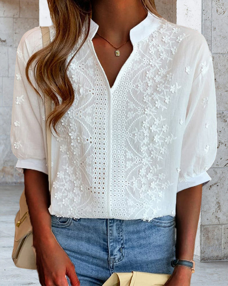 Victoria Lumina puff sleeve blouse with V-neck design, featuring elegant fabric and stylish detailing.