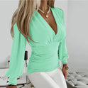 Lumina Wear Victoria elegant V-neck blouse with refined detailing, featuring soft fabric and stylish design for sophisticated look.