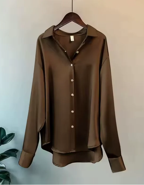 White button-down blouse with relaxed fit by Lumina Wear, featuring elegant design and classic collar for a sophisticated look.