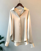 White button-down blouse with relaxed fit from Lumina Wear, featuring a classic collar and stylish, elegant design.