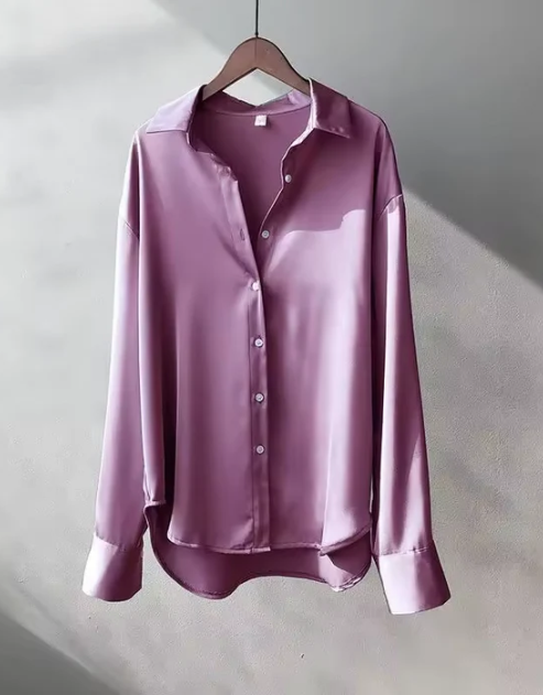 White button-down blouse with relaxed fit from Lumina Wear, styled on a model showcasing elegant, casual office-ready fashion.