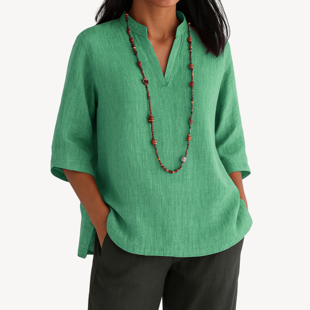Victoria Lumina linen tunic top with minimalist design, relaxed fit, and lightweight fabric, ideal for casual wear.