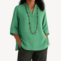 Light beige Victoria linen tunic top by Lumina Wear featuring a relaxed fit and minimalist design, displayed on a neutral background.