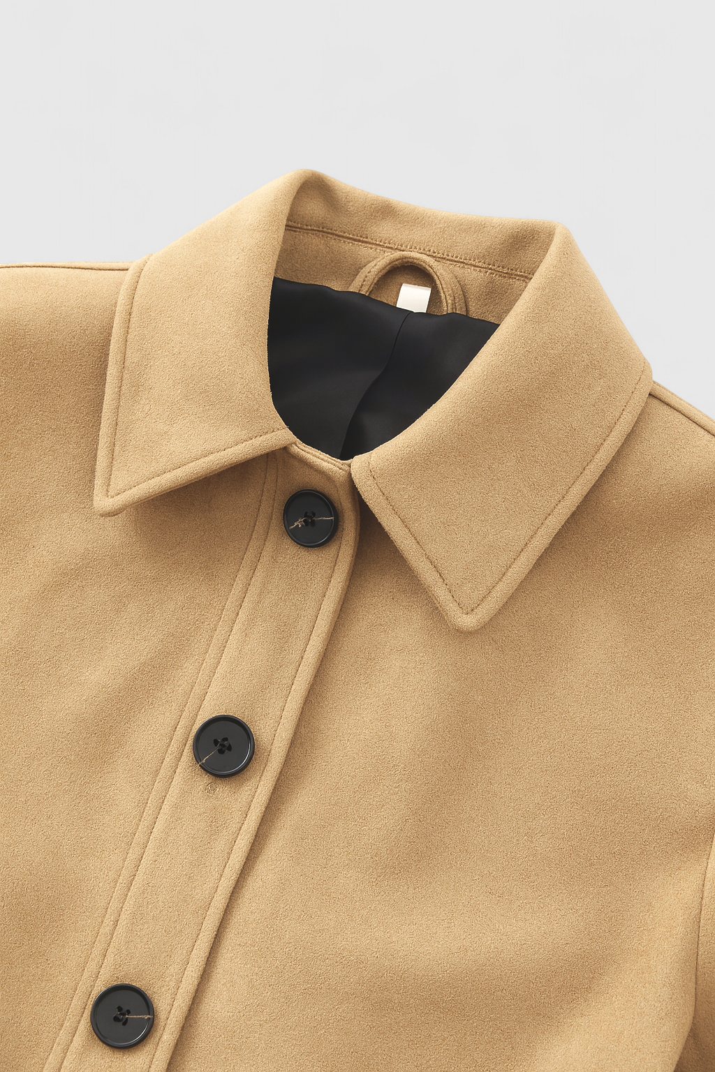 Victoria Lumina retro-inspired short jacket with button closure, featuring stylish design and lightweight fabric.