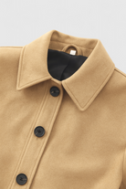 Victoria Lumina retro-inspired short jacket with button closure, featuring stylish design and lightweight fabric.