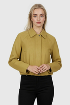 Yellow bomber jacket by Lumina Wear featuring trendy details and a stylish design, shown on a model.