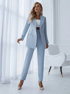 Victoria Lumina Wear tailored double-breasted suit set with long blazer, featuring sleek fabric and structured fit.