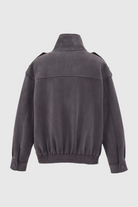Dark gray Victoria bomber jacket by Lumina Wear featuring a stand collar and trendy design, shown on a model.