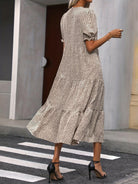 Beige Adelina™ tiered puff sleeve dress by Lumina Vancouver, featuring layered fabric and elegant puff sleeves.