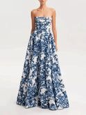 Blue Aitana floral evening gown by Lumina Wear, showcasing elegant floral patterns and a flowing design for formal events.