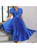 Elegant champagne evening dress by Lumina Wear, featuring a flowing design perfect for wedding guest attire.