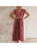 Elegant champagne evening dress by Lumina Wear featuring a fitted bodice and flowing skirt, perfect for wedding guests.
