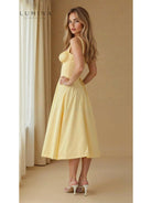 Yellow Alina waist dress by Lumina Vancouver, elegant and flattering wedding guest dress with chic style.