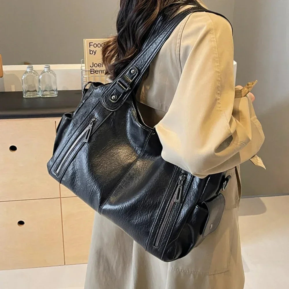 Black Lumina Wear Aliona backpack with multiple compartments and adjustable straps, stylish and versatile for school use.