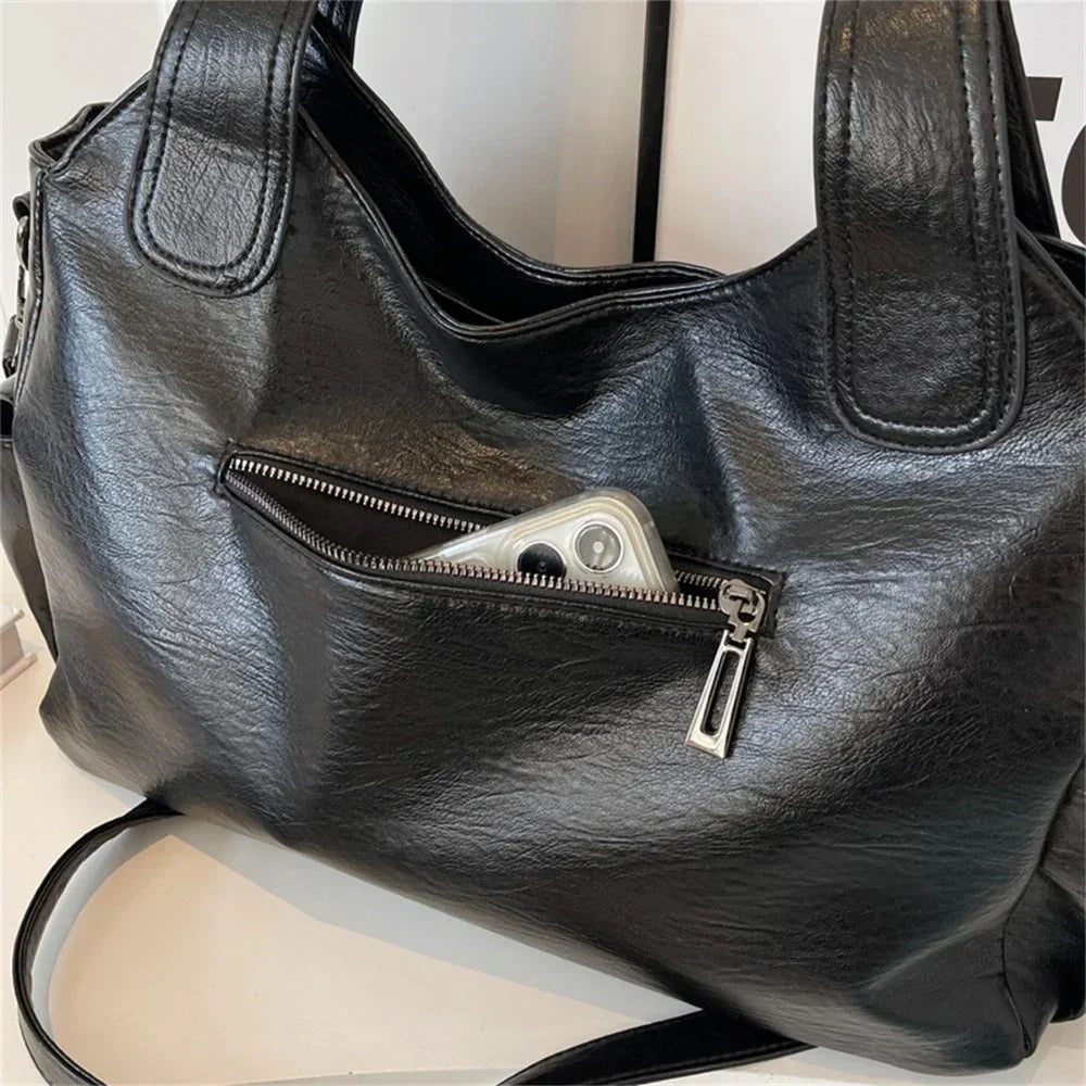 Black Aliona Lumina Wear backpack with versatile compartments, stylish design, and comfortable straps for school and daily use.