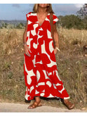 Black Alvina relaxed abstract dress by Lumina Wear, featuring flowing fabric and artistic print, perfect for casual or stylish occasions.