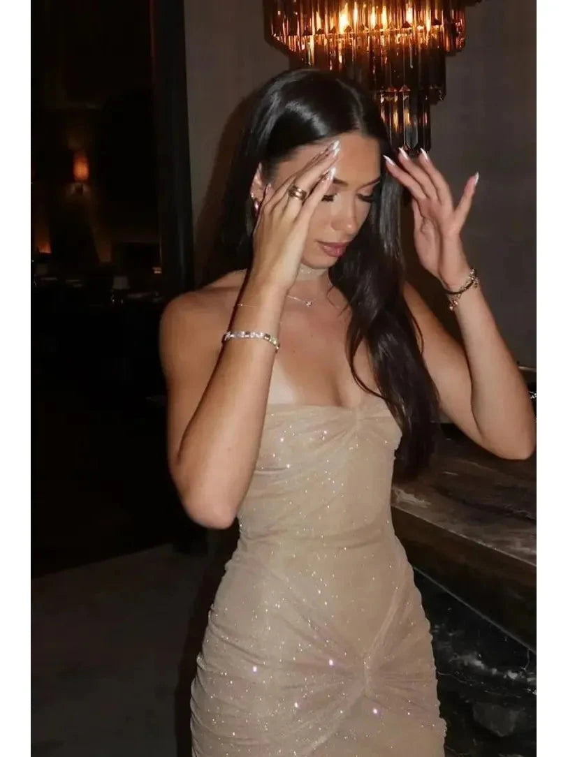 Girls wearing the Lumina Vancouver Amalia shimmer fishtail maxi dress for a night out, featuring a fitted bodice and flowing skirt.