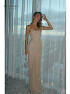 Lumina Vancouver Amalia shimmer fishtail maxi dress for girls night out, featuring elegant design and shimmering fabric.