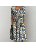 Red floral printed dress by Lumina Wear, Violette classic dress with elegant design, shown laid flat.