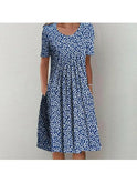 Violette classic printed dress by Lumina Wear featuring a red floral pattern, sleeveless design, and knee-length fit.