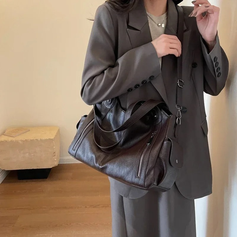 Elegant black shoulder bag by Lumina Wear featuring a functional design, perfect for stylish everyday use.
