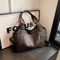 Black Lumina Wear handbag with amber accents, elegant shoulder bag featuring a functional design and stylish appearance.
