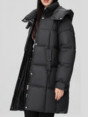 Black Amelia Lumina Wear hooded longline puffer coat with belt, stylish winter outerwear, shown on a model.