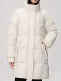 Black Amelia hooded longline puffer coat with belt by Lumina Wear, featuring a stylish, quilted design and cozy winter insulation.