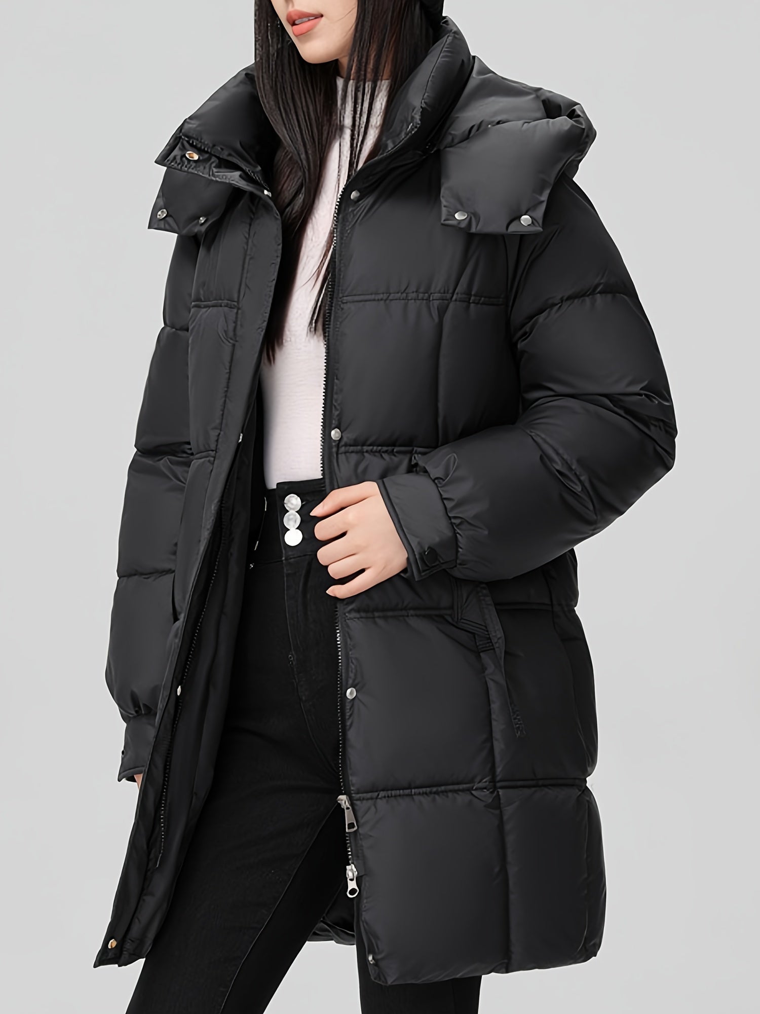 Black Amelia Lumina Wear hooded longline puffer coat with belt, stylish winter outerwear with a cozy, padded design and belt detail.
