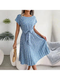 Blue Anabelle floral pleated midi dress by Lumina Wear, featuring a flowing, feminine design with a fitted waist and elegant silhouette.