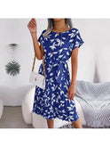 Blue Anabelle floral pleated midi dress by Lumina Wear, featuring a flowy design and elegant floral pattern.
