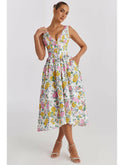 Yellow floral summer dress by Lumina Wear with a flowing silhouette and elegant design, perfect for warm-weather occasions.